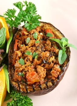 Egg plant stuffed with bolognaise with side salad and garnish.