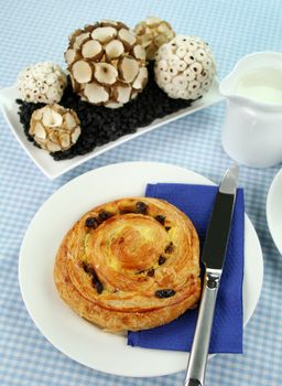 Delicious sultana danish pastry with table decoration.