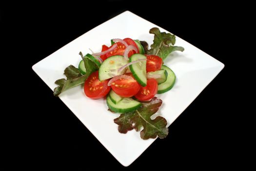 Delightful garden fresh tomato and cucumber salad.