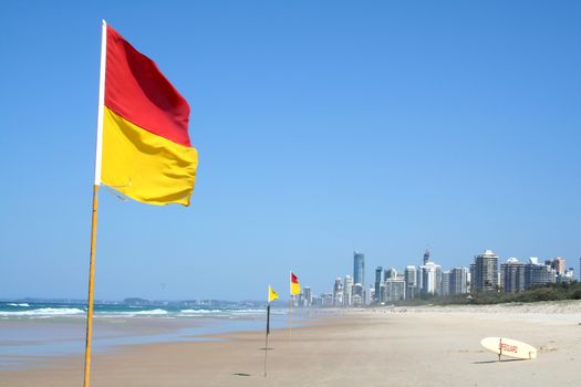 Swimming safety flags on the Gold Coast Northern beach looking towards Surfers Paradise.