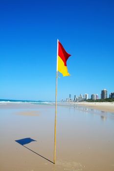 Swimming safety flag on the Gold Coast Northern beach looking towards Surfers Paradise.