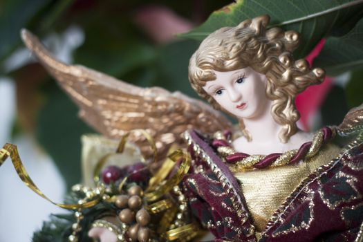Close up of a porcelain Christmas angel blurred background