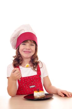 happy little girl cook eat cake