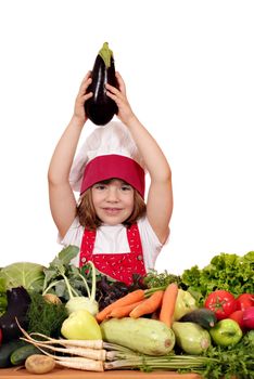 little girl cook holding aubergine over his head 