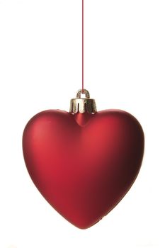 christmas, red christmas ball as heart hanging isolated 