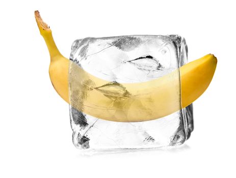 banana in a ice cube isolated with white background 