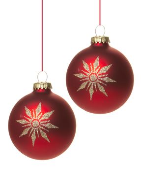 red christmas baubles with white pattern, star isolated hanging with white background 