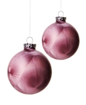 pink christmas balls with pattern isolated hanging with white background 