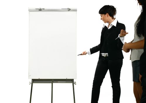 The business girl shows something on a board