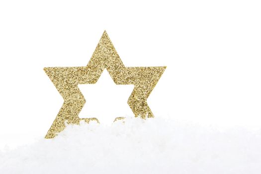 golden christmas star on snow 