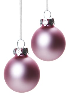 pink christmas balls isolated hanging with white background 