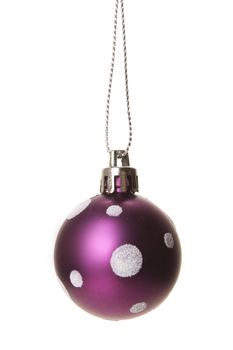 purple christmas ball with white pattern isolated hanging with white background 