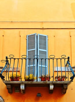 The Renovated Facade of the Old Italian House with Balcony