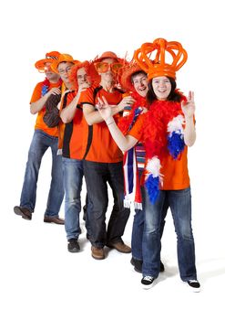 Group of Dutch soccer fans making polonaise over white background