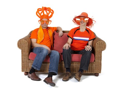 Two Dutch soccer fan watching game over white background