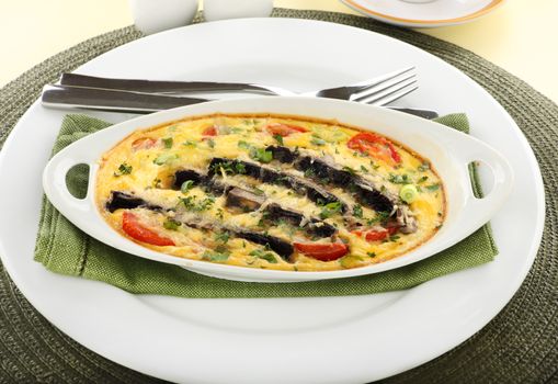 Delicious mushroom and tomato bake served with toast for breakfast.