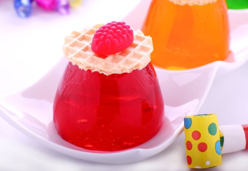 Strawberry and orange jellies at a kids party.