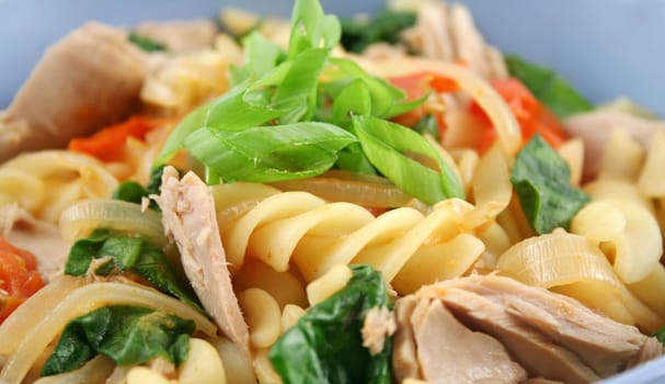 Delicious tuna spinach and tomato pasta ready to serve.