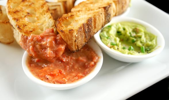 Delicious and colorful capsicum dip with grilled Turkish bread.