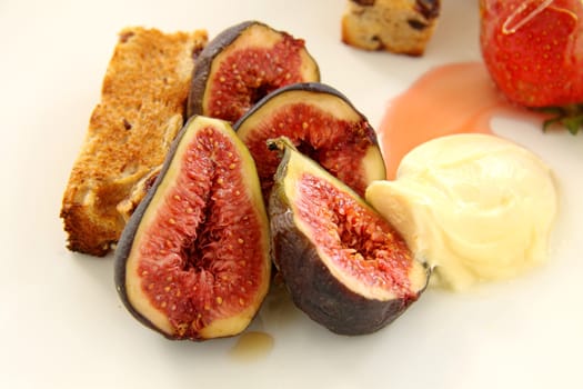 Delicious fresh figs with cream and honey drizzled over the top.