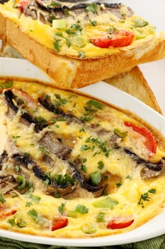 Delicious mushroom and tomato bake served on toast for breakfast.