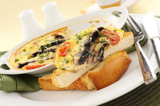 Delicious mushroom and tomato bake served on toast for breakfast.