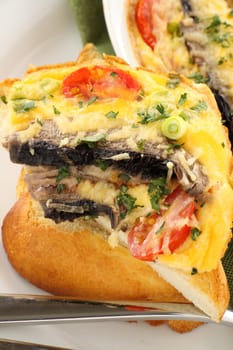 Delicious mushroom and tomato bake served on toast for breakfast.