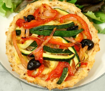 Delicious Mediterranean style vegetable and ricotta tart with salad.
