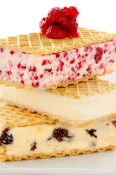 Delicious triple decker wafer ice cream with raspberry, vanilla and coffee and raisin ice cream.