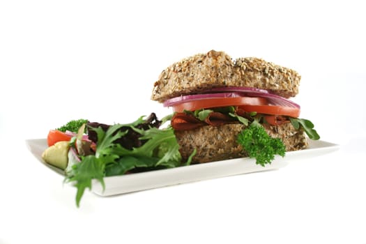 Pastrami and salad wholegrain seeded roll ready to serve.