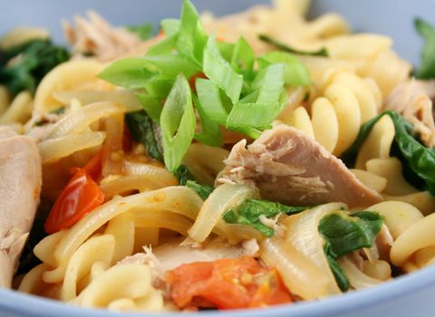 Delicious tuna spinach and tomato pasta ready to serve.