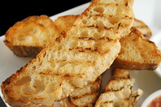 Slices of crisp golden grill toasted Turkish bread.