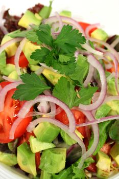 Vertical framing of a delicious tossed salad ready to serve.