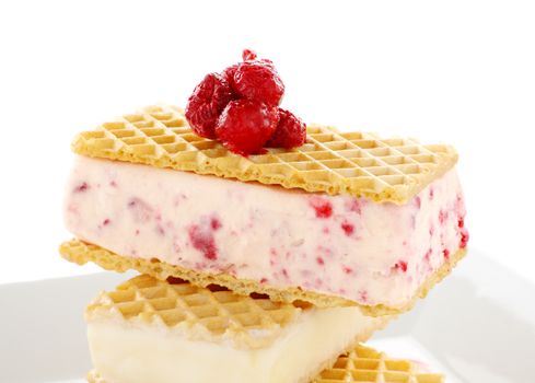 Delicious triple decker wafer ice cream with raspberry and vanilla ice cream.