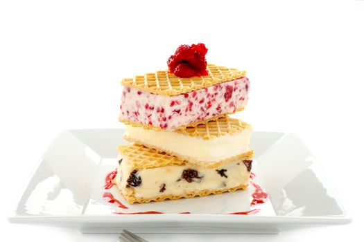 Delicious triple decker wafer ice cream with raspberry, vanilla and coffee and raisin ice cream.