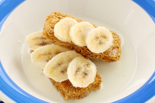 Iconic Australian breakfast cereal Weet Bix served with sliced banana.