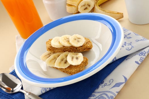 Iconic Australian breakfast cereal Weet Bix served with juice and banana.