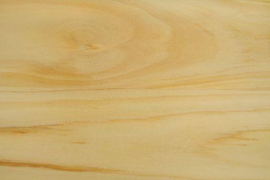 Light colored wood grain textured background with streaks.