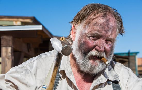 Old West Blacksmith Smokes a Cigar