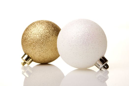 golden and white christmas baubles  isolated 
