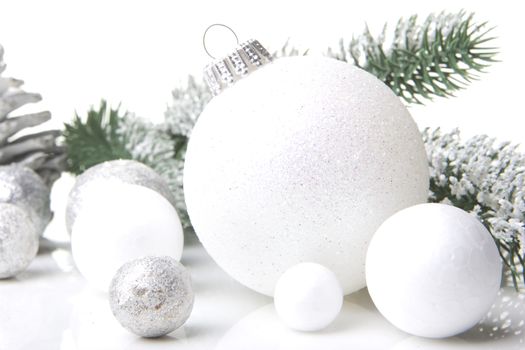 christmas, decoration with fir branch, pine cones, christmas bauble silver and white