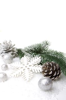 christmas, decoration with fir branch, pine cones, christmas bauble silver and white