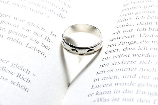 heart in a book by a ring