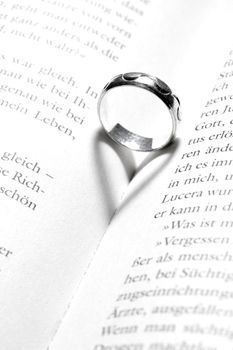 heart in a book by a ring