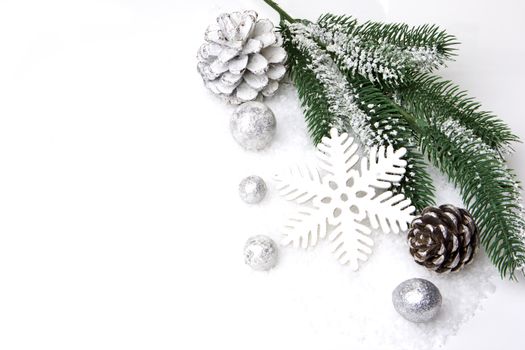 christmas, decoration with fir branch, pine cones, christmas bauble silver and white