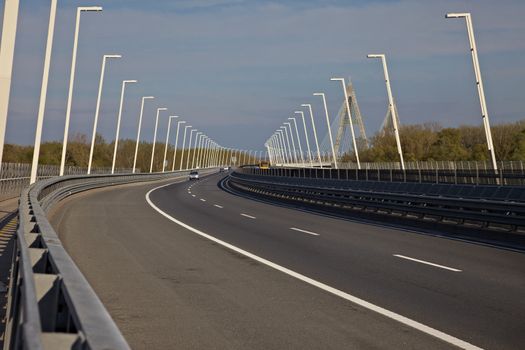 Highway over a bridge with little traffic