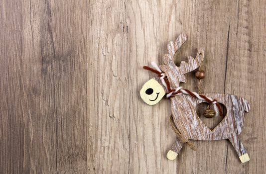 christmas decoration with wood background, snow, elk