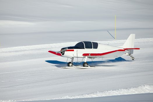 Snowplane landing in the mountains