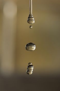 The fluid motion of water splashing as it is poured.