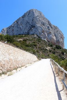 Natural Park of Penon de Ifach situated in Calp, Spain. A massive limestone outcrop emerging from the sea and linked to the shore by rock debris. Is home to numerous rare plants and over 300 species of animals, and nesting site for sea birds and other birds.
